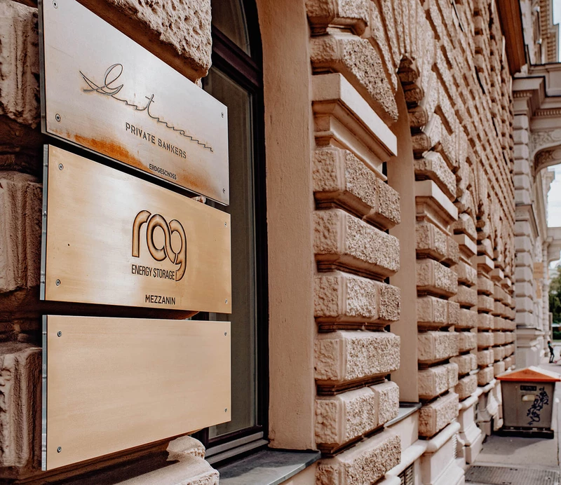 RAG logo in gold on the facade of the office building